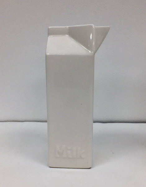 Set of four white ceramic pop art design collectibles