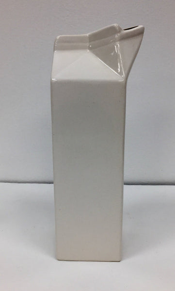Set of four white ceramic pop art design collectibles