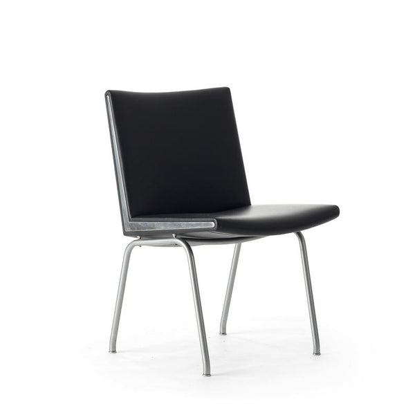 Set of two black vinyl and steel Kastrup chairs by Hans Wegner made by A.P. Stolen