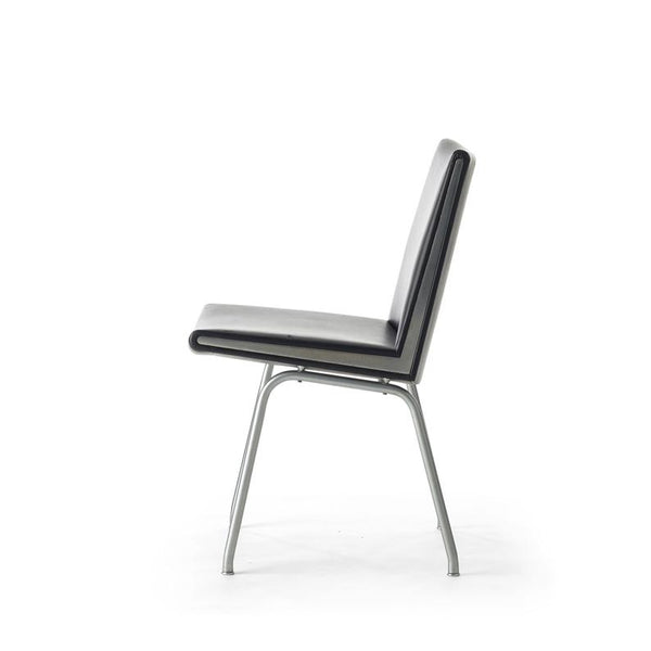 Set of two black vinyl and steel Kastrup chairs by Hans Wegner made by A.P. Stolen