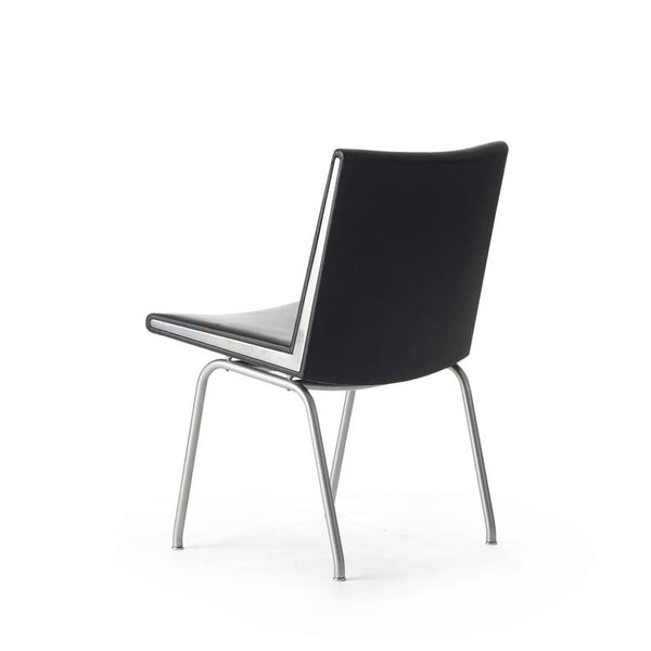 Set of two black vinyl and steel Kastrup chairs by Hans Wegner made by A.P. Stolen