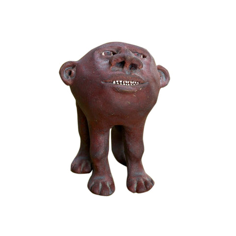 Surreal ceramic anthropomorphic sculpture of head with four legs