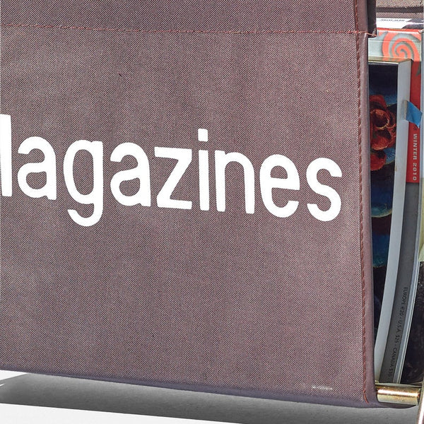 Vintage folding magazine rack made out of fabric and chrome