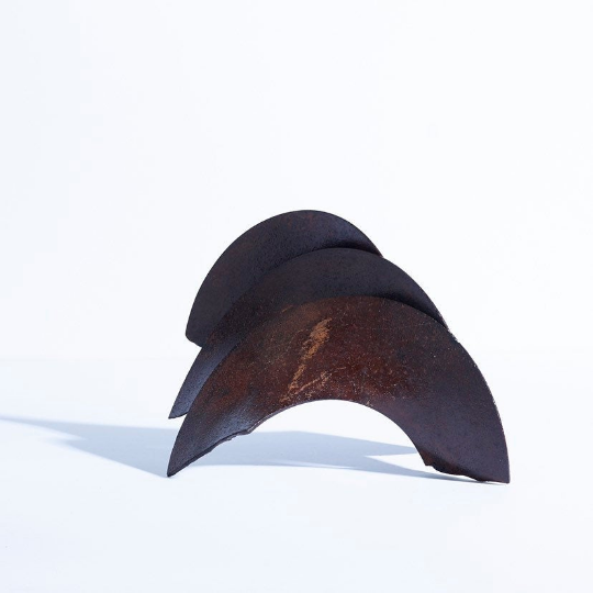 Welded iron brutalist blade sculpture in the style of Richard Serra