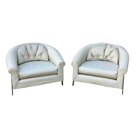 Pair of large white vinyl and chrome lounge chairs